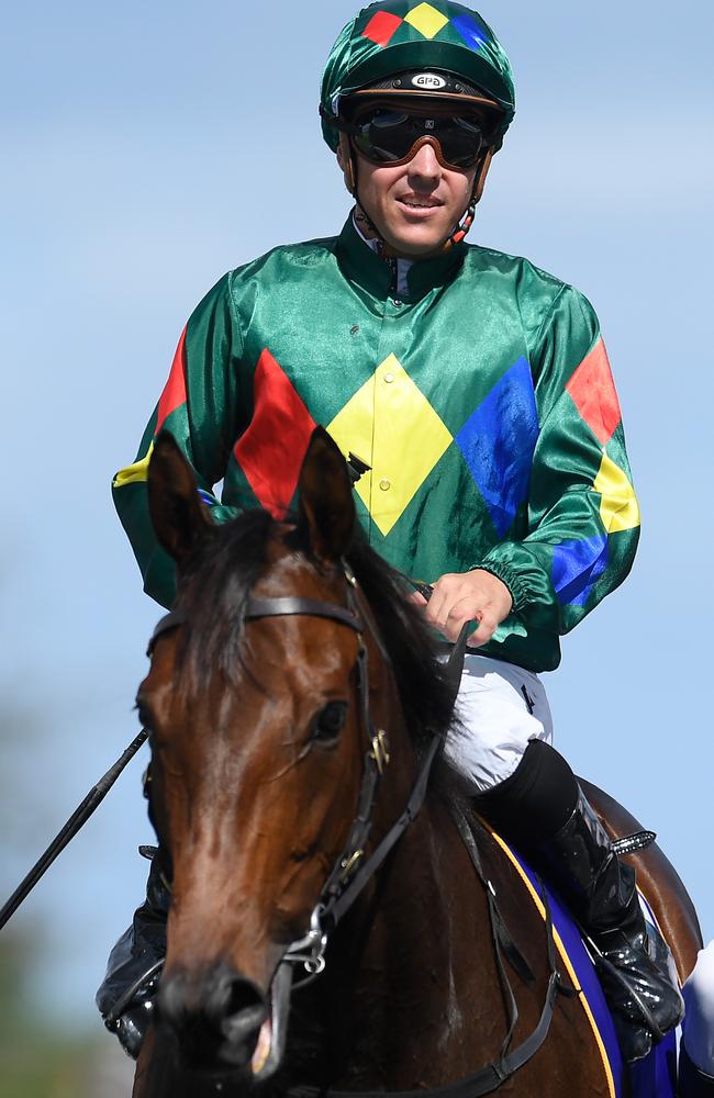 Ryan Maloney returns to scale after riding Alligator Blood to victory.