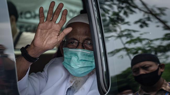 Radical Muslim cleric Abu Bakar Bashir waves as he arrives at his home at the al-Mukmin Islamic boarding school in Ngruki in January 2021. Picture: Getty Images