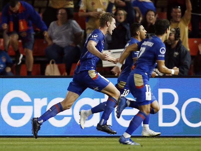 Jets players run to celebrate after Nick Cowburn of the Jets scores a second half equaliser during the Round 4 A-League match between the Newcastle Jets and Sydney FC at McDonald Jones Stadium in Newcastle, Saturday, November 10, 2018. (AAP Image/Darren Pateman) NO ARCHIVING, EDITORIAL USE ONLY