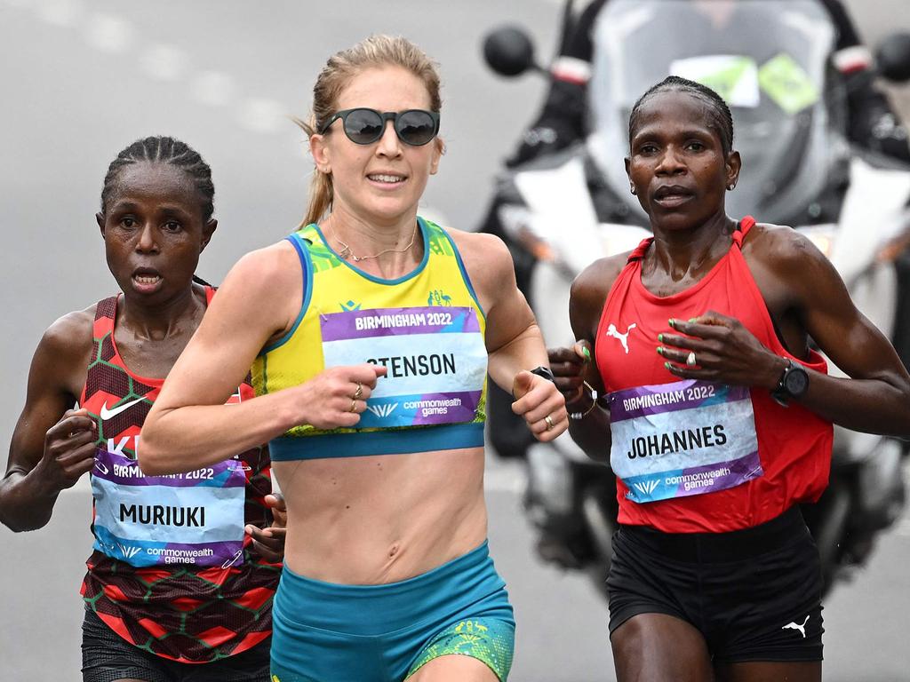 Kenya's Margaret Wangari Muriuki (L) and Namibia's Helalia Johannes flank Jess Stenson who would go on and win marathon gold. (Photo by Andy Buchanan / AFP)