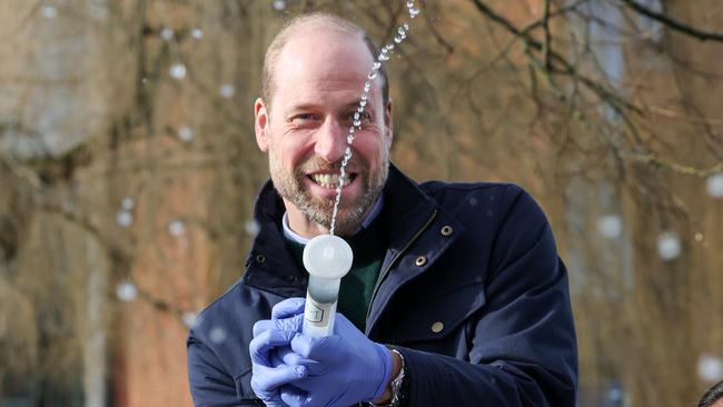 GUILDFORD, ENGLAND - JANUARY 29: William, Prince of Wales has fun with local school children as they filter DNA samples through a syringe after extracting water from a local pond in order to see what species live in it on January 29, 2025 in Guildford, England. The Prince was visiting the 2024 Earthshot Prize Finalist, NatureMetrics, a UK based nature company based in Guildford which enables companies to measure and report on their impact on nature and ecosystems. (Photo by Richard Pohle - WPA Pool/Getty Images)