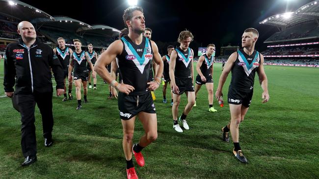 Travis Boak of the Power leads his side from the field after a loss. Picture: Getty Images