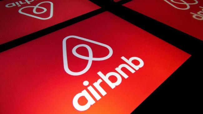 Logo of the online lodging service Airbnb displayed on a tablet in Paris. (Photo by Lionel BONAVENTURE / AFP)