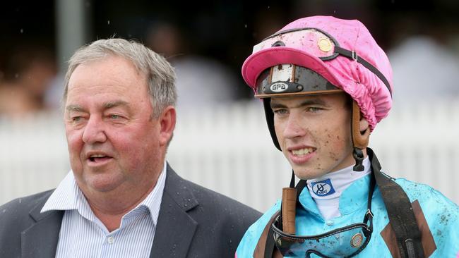 Races a Doomben. Winner race 7, number 14 , Sold for Song, Jockey James Orman (right) with trainer Kevin Kemp.   Pic Jono Searle.