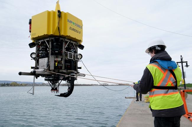 The robot made by Impossible Metals prepares to enter the water in Collingwood, Canada