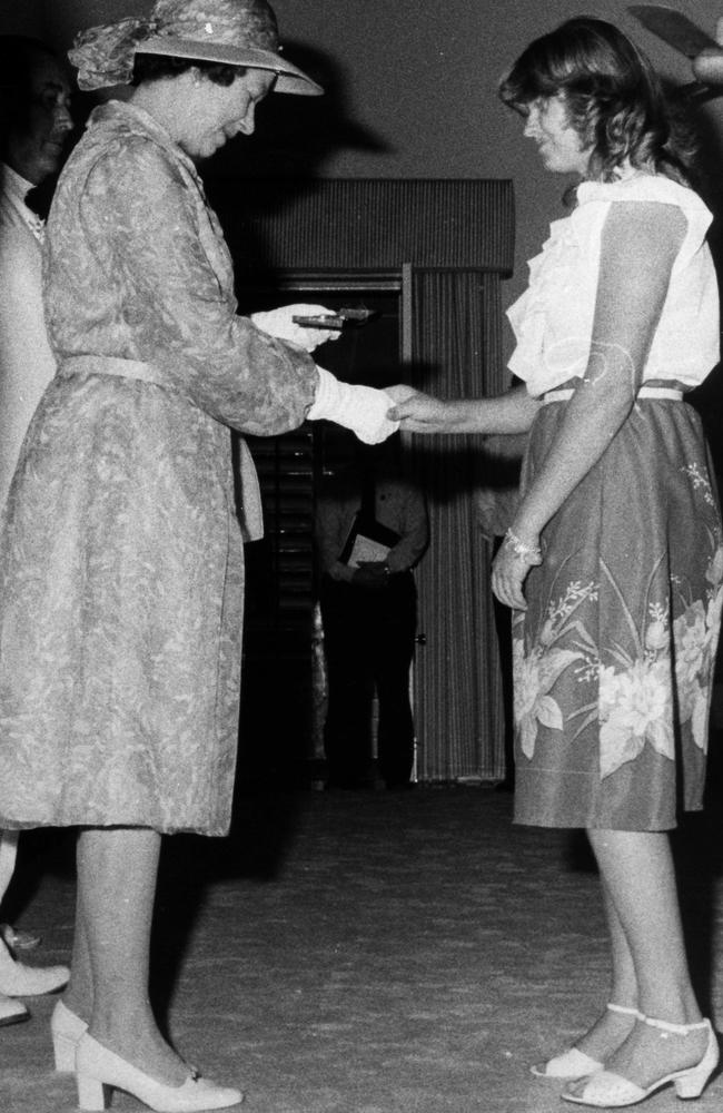 Peta Lynn Mann receives her award from Queen Elizabeth in October 1982. Picture: Clive Hyde