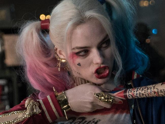 Hi-res shot of Margot Robbie in Suicide Squad released by Warner Bros. Also features Adewale Akinnuoye-Agbaje as Killer Croc.