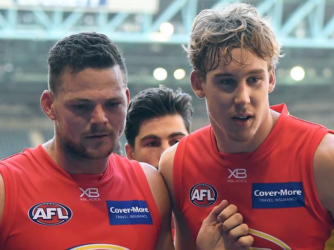 Steven May (left) and Tom Lynch of the Suns are seen after the Round 2 AFL match between the Carlton Blues and the Gold Coast Suns at Etihad Stadium in Melbourne, Saturday, March 31, 2018. (AAP Image/Julian Smith) NO ARCHIVING, EDITORIAL USE ONLY