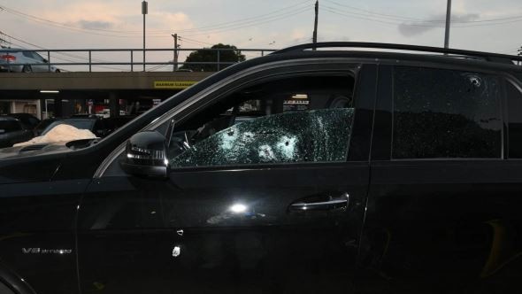 Bullet holes in the front passenger window of slain ex-Sydney bikie boss Mick Hawi. Picture: supplied.