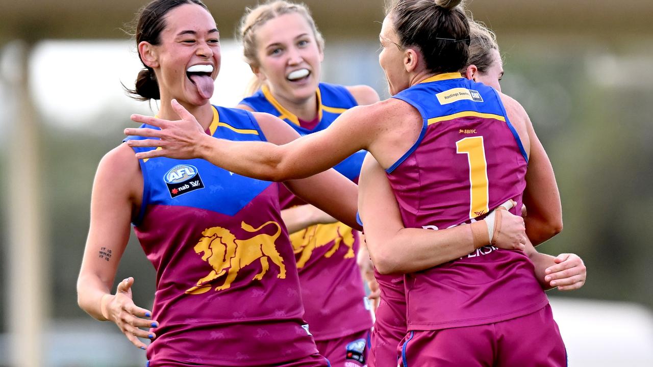 Emily Bates is congratulated by teammates after kicking a goal against Collingwood at Maroochydore last week. Picture: Getty Images