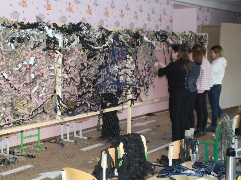 Women in Starokostiantyniv spend their days tearing up old rags to make camouflage nets for bunkers, air missile defence systems and checkpoints as they prepare for Russian invaders. Picture: Charles Miranda,