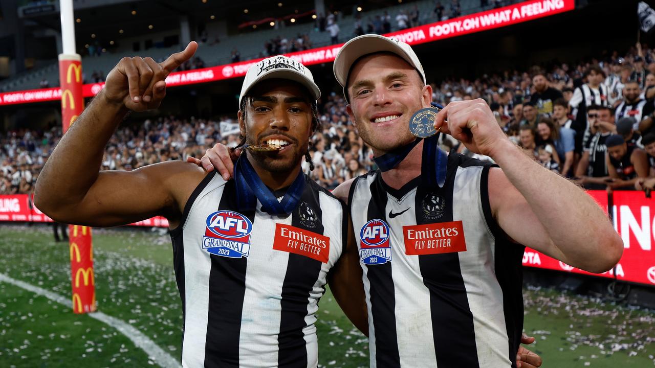 MELBOURNE, AUSTRALIA - SEPTEMBER 30: Isaac Quaynor of the Magpies and Tom Mitchell of the Magpies celebrates during the 2023 AFL Grand Final match between the Collingwood Magpies and the Brisbane Lions at the Melbourne Cricket Ground on September 30, 2023 in Melbourne, Australia. (Photo by Michael Willson/AFL Photos via Getty Images)