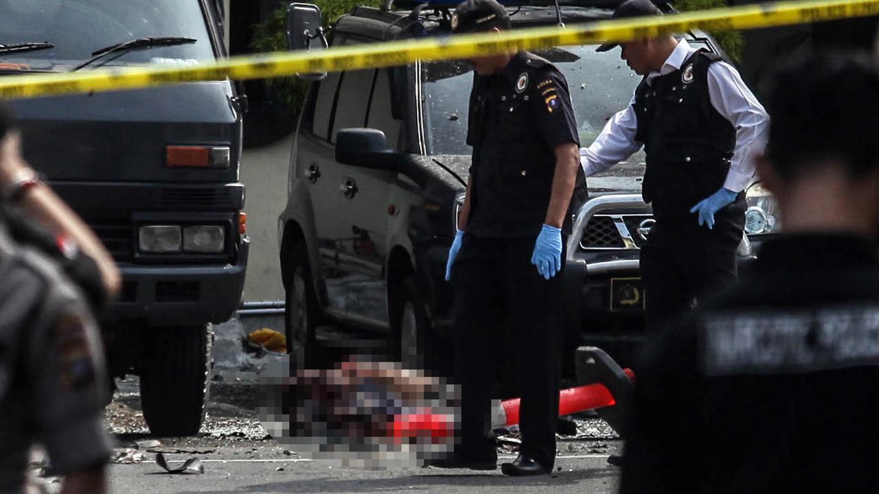 Indonesian police examine a body of a suspected suicide bomber at their headquarters in Medan, North Sumatra. The attack occurred about 12.45pm AEDT. Picture: Albert Damanik / AFP