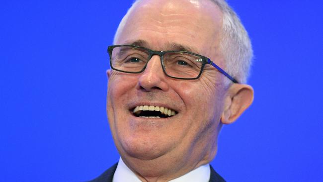 Malcolm Turnbull finds something to smile about at the Liberal Party’s Federal Council Meeting, despite the Coalition’s poll slump. (Pic: Dan Himbrechts/AAP)