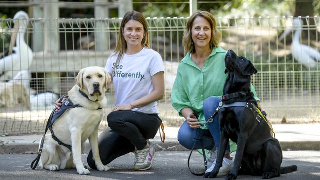 Sophie Slattery, with See Differently assistance dog Ivan, and Lisa Cundy with Lana, at the launch of Adelaide Zoo’s Assistance Animal Program. Picture: Roy VanDerVegt