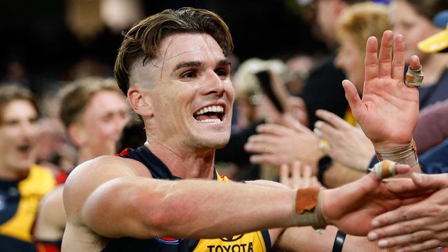 MELBOURNE, AUSTRALIA - APRIL 13: Ben Keays of the Crows celebrates with fans during the 2024 AFL Round 05 match between the Carlton Blues and the Adelaide Crows at Marvel Stadium on April 13, 2024 in Melbourne, Australia. (Photo by Dylan Burns/AFL Photos via Getty Images)