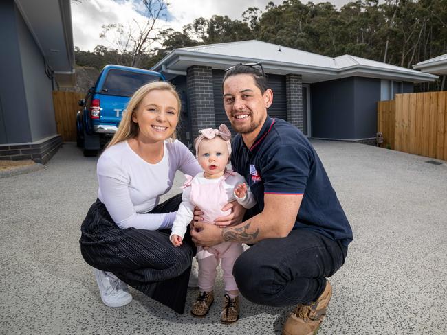 Tekaniwha (TK) Ahipene and partner Laura Donnelly with their daughter Isla at the investment property they recently purchased in the Hobart suburb of Glenorchy.11/10/2019photography Peter Mathew