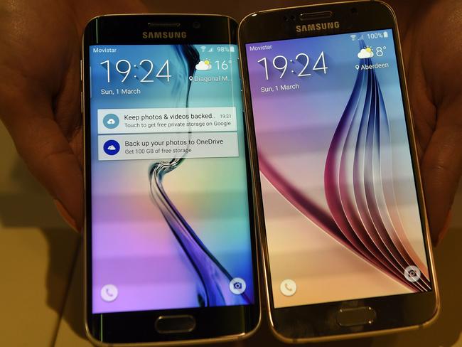 The Samsung Galaxy S6 Edge (L) and Samsung Galaxy S6 are presented during the 2015 Mobile World Congress in Barcelona on March 1, 2015. The 2015 Mobile World Congress, where participants can attend conferences and discover cutting-edge products and technologies, is the world's biggest mobile fair and will be held from March 2 to 5 in Barcelona. AFP PHOTO/ LLUIS GENE