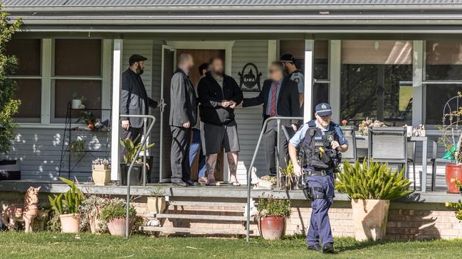 Detectives arrest and handcuff Callaway. Picture: NSW Police