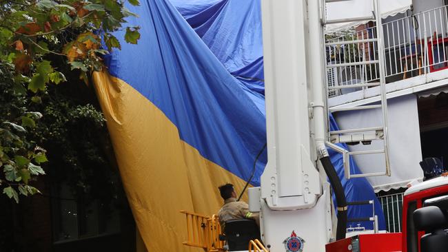 A hot-air balloon was left strewn across an apartment building in Elwood after a crash landing in April. Picture: NCA NewsWire / David Crosling