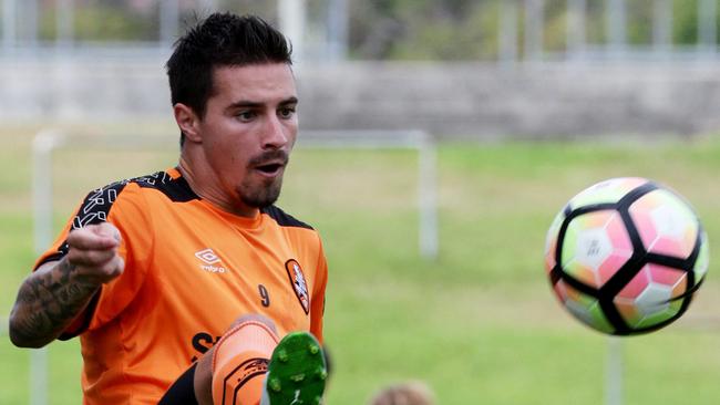 Jamie Maclaren his a volley at Roar training at Ballymore.  Picture: Steve Pohlner.