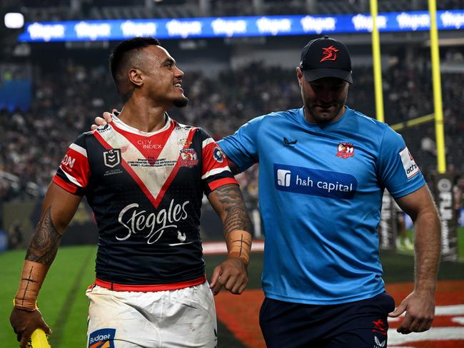 Spencer Leniu continues his exchange with Broncos players from the sidelines. Picture: NRL Photos