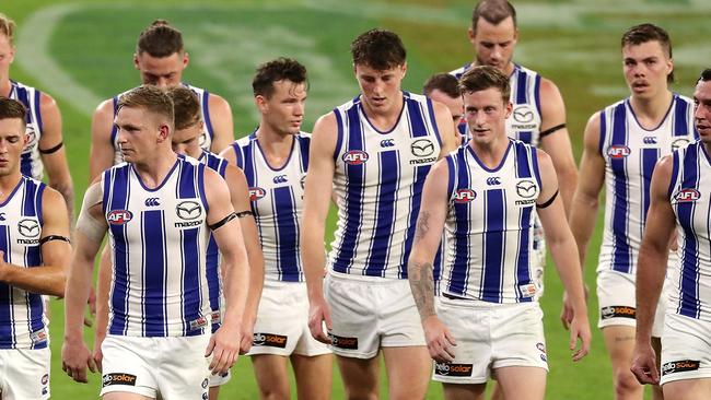 PERTH, AUSTRALIA - APRIL 24: The Kangaroos leaves the field at the main break during the 2021 AFL Round 06 match between the Fremantle Dockers and the North Melbourne Kangaroos at Optus Stadium on April 24, 2021 in Perth, Australia. (Photo by Will Russell/AFL Photos via Getty Images)