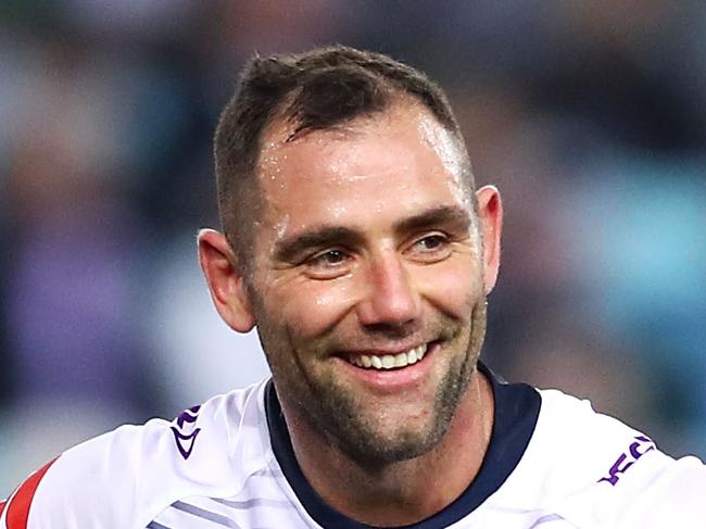 SYDNEY, AUSTRALIA - AUGUST 03: Cameron Smith of the Storm smiles as he watches on Cameron Smith during the round 21 NRL match between the South Sydney Rabbitohs and the Melbourne Storm at ANZ Stadium on August 3, 2018 in Sydney, Australia. (Photo by Mark Kolbe/Getty Images)