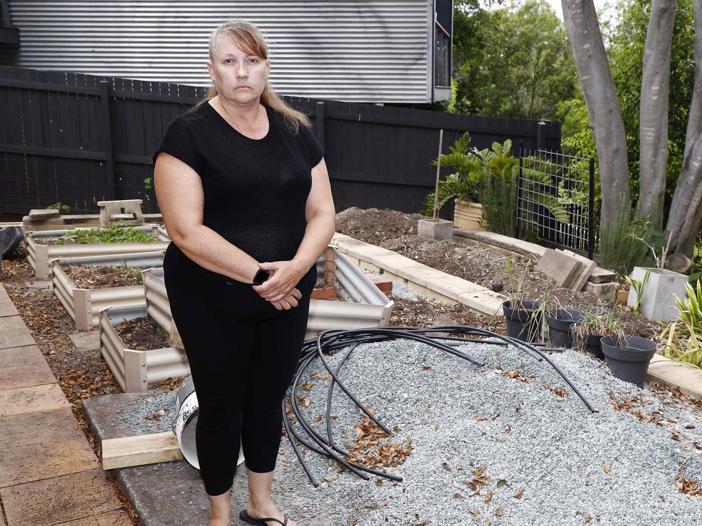 Loretta Davis is a single mother of three still living in a flood-damaged house in Graceville. Picture: Tertius Pickard