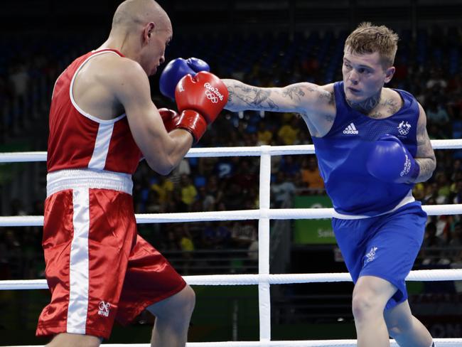 Australia's Daniel Jason Lewis, right, fights Poland's Tomasz Jablonski during a men's middleweight 75-kg boxing match at the 2016 Summer Olympics in Rio de Janeiro, Brazil, Tuesday, Aug. 9, 2016. (AP Photo/Frank Franklin II)