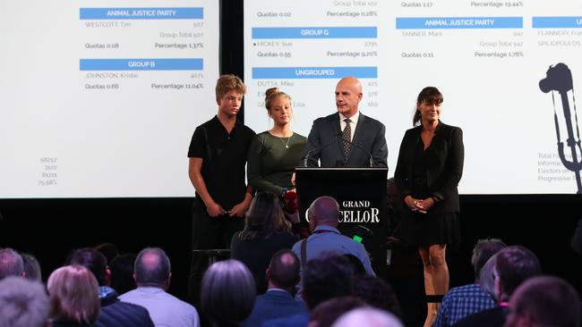 Premier Peter Gutwein arrives inside the tally room alongside wife Amanda and children Finn and Millie as he celebrates the Liberal party's win during the Tasmania state election 2021. Picture: Zak simmonds