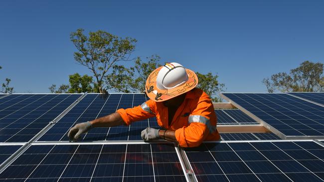 Workers installing solar panels in the Northern Territory. Picture: AAP