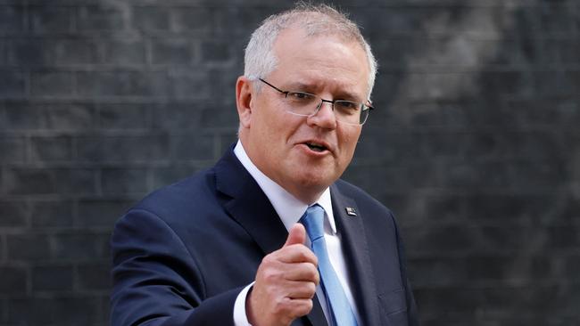 Prime Minister Scott Morrison gestures as he leaves 10 Downing street. Picture: AFP