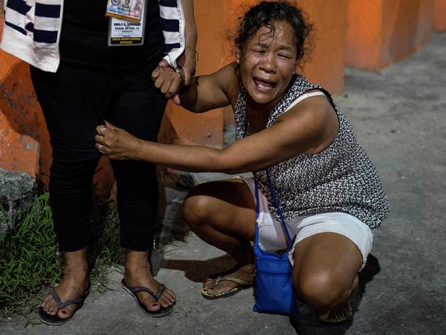 Maria Espinosa, pictured crying outside the funeral parlour where the body of her dead 16-year-old son, Sonny was taken after being killed last year. Picture: Noel Celis/AFP