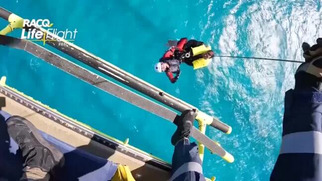 Watch dramatic sea rescue of brothers off Queensland