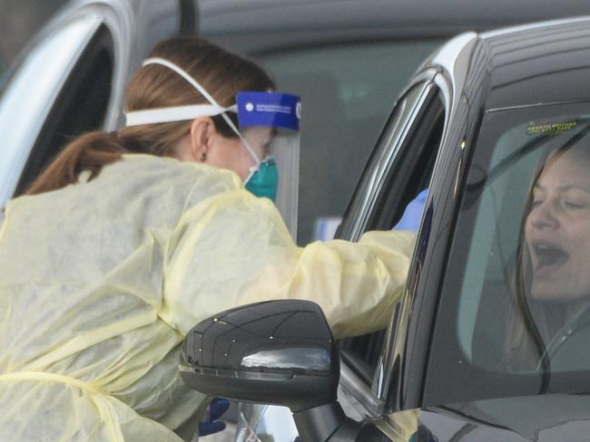 ADELAIDE, AUSTRALIA - NewsWire Photos JULY 01, 2021 -  Lines of cars and health workers at the Victoria Park Covid testing clinic in Adelaide. Picture: NCA NewsWire / Brenton Edwards