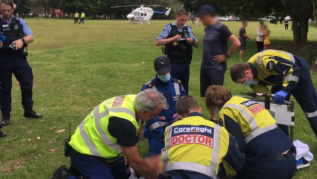 CareFlight emergency helicopter medical crew and ambulance paramedics stabilise the injured boy before he is flown to The Children’s Hospital, Westmead. Picture: CareFlight