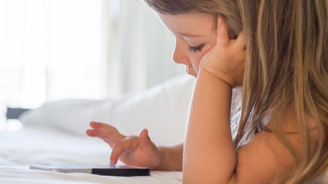 Thinkstock: Townsville Families: Child using mobile phone at home