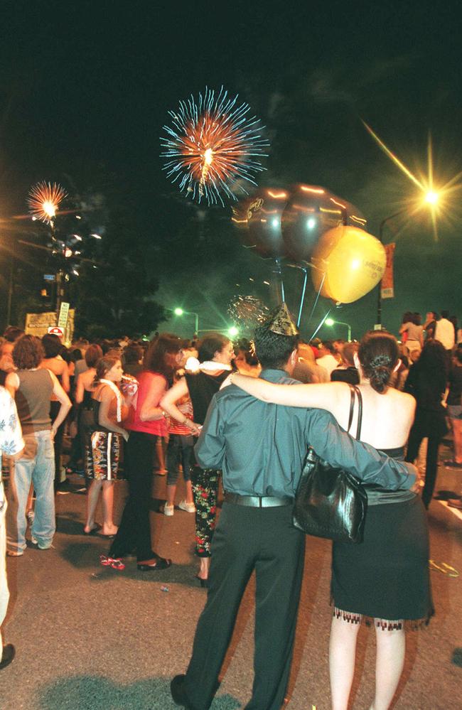 People watching fireworks during New Years Eve party celebrations in Queen Street Mall, Brisbane, Queensland 01 Jan 2000. Photo: Courier Mail archives