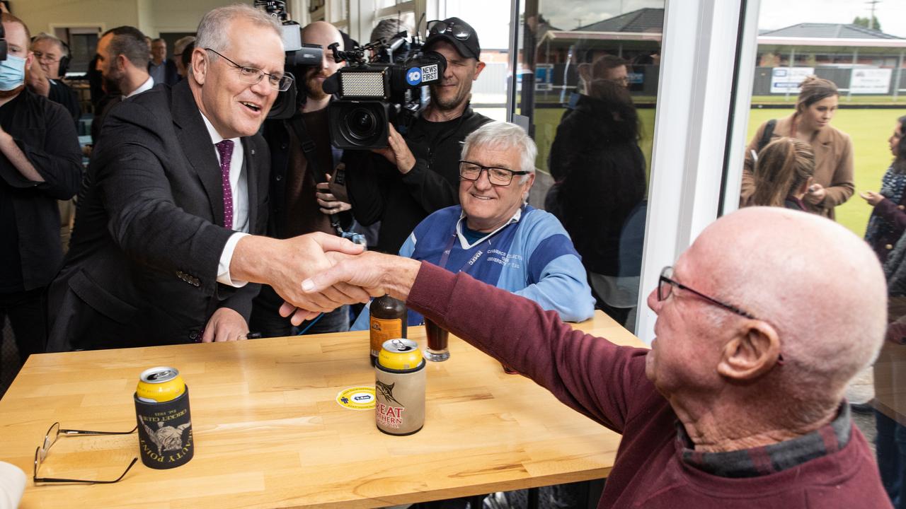 Mr Scott Morrison catches up with one of the locals. Picture: Jason Edwards