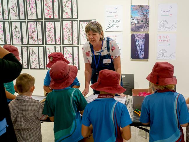 Gladstone Central School students with volunteer Leanne at the 2019 Saiki Children's Day exhibition. Picture: Gladstone Regional Council