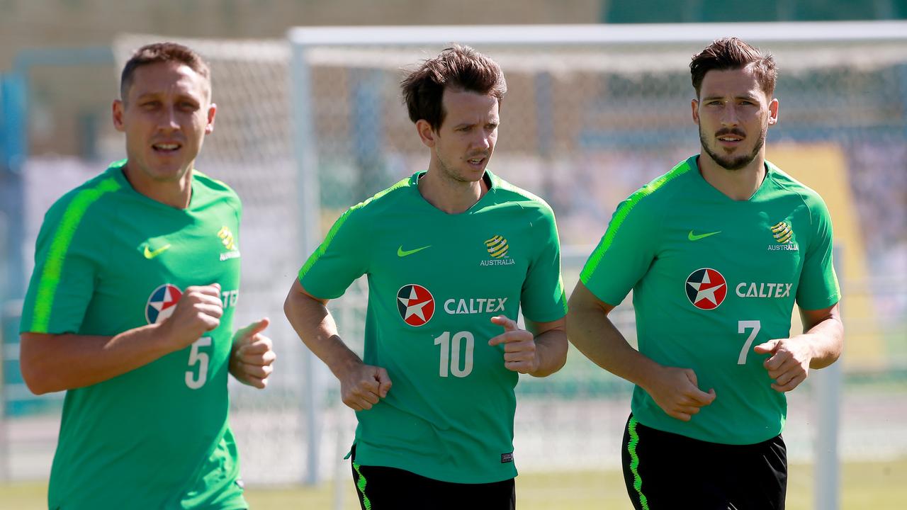 Mark Milligan, Robbie Kruse and Mathew Leckie train with the Socceroos