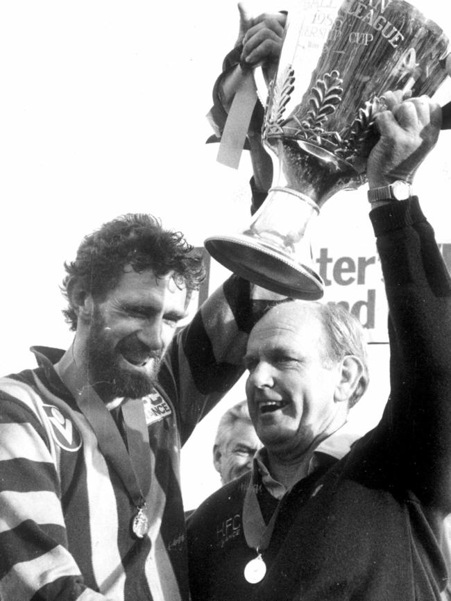 1986: Allan Jeans (R) and Michael Tuck with the premiership cup after Hawthorn Hawks defeated Carlton Blues in the Grand Final at the MCG.