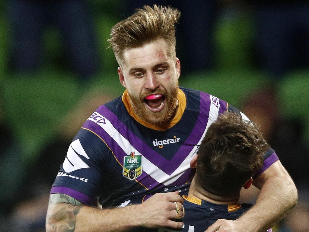 Curtis Scott of the Storm (right) celebrates a try with Cameron Munster of the Storm during the Round 23 NRL match between the Melbourne Storm and the Parramatta Eels at AAMI Park in Melbourne, Friday, August 17, 2018. (AAP Image/Daniel Pockett) NO ARCHIVING, EDITORIAL USE ONLY