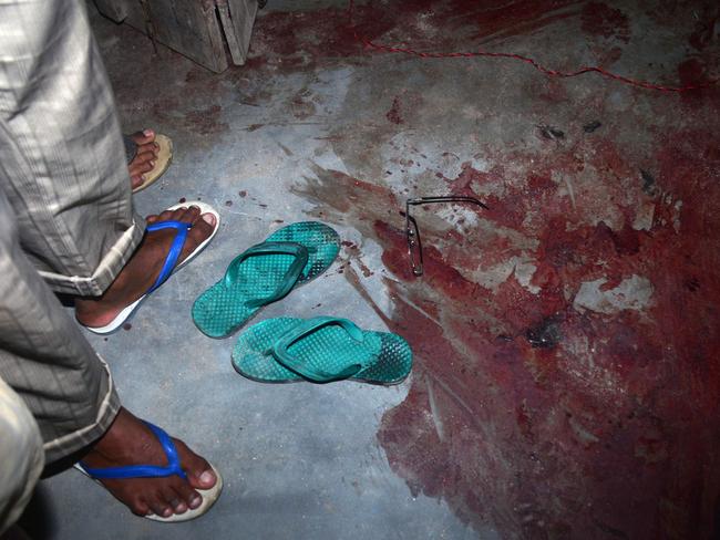 Blood stains the floor of a shop after a militant attack at Balajan Tinali, in the Kokrajhar district of Assam. Picture: AFP
