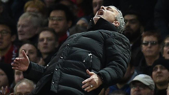 Manchester United's Portuguese manager Jose Mourinho gestures on the touchline during the English Premier League football match between Manchester United and Tottenham Hotspur at Old Trafford in Manchester, north west England, on December 11, 2016. / AFP PHOTO / OLI SCARFF / RESTRICTED TO EDITORIAL USE. No use with unauthorized audio, video, data, fixture lists, club/league logos or 'live' services. Online in-match use limited to 75 images, no video emulation. No use in betting, games or single club/league/player publications. /