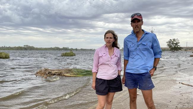 Alex and Mark Westlake inspect their flooded farm. Photo: Dylan Hogarth.