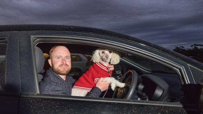 James Grant of Kidman Park and his toy spoodle Chino at the Wallis Mainline Drive-In at Gepps Cross. Picture: Brenton Edwards