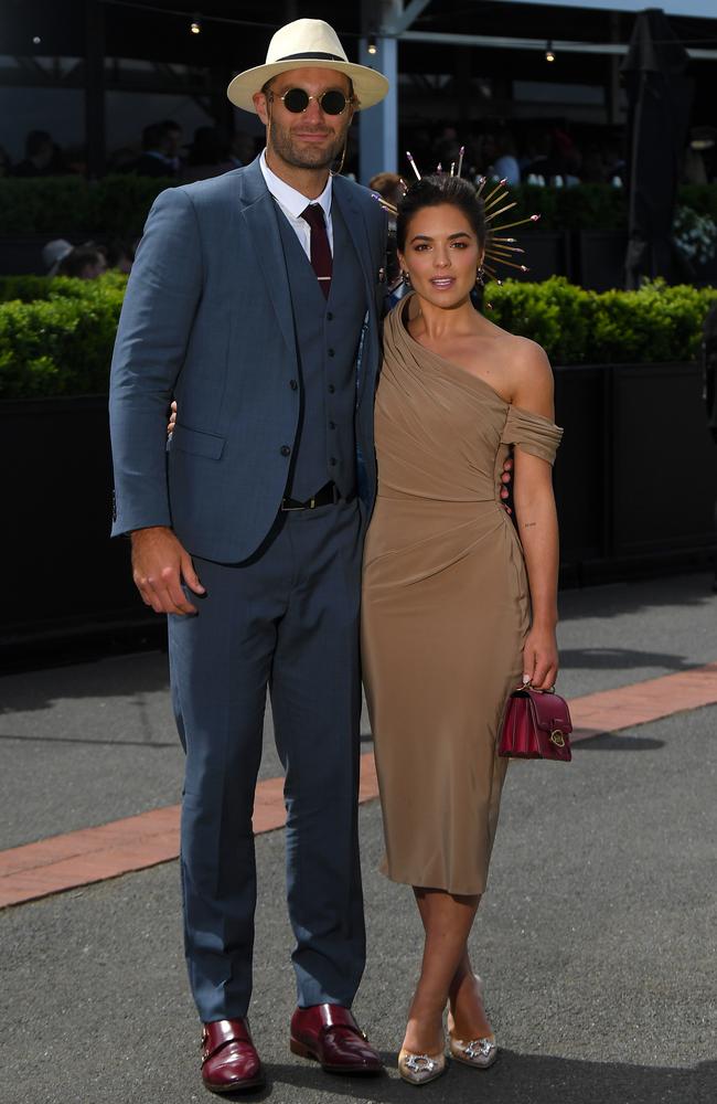 In a lesson in power couple dressing, actress Olympia Valance (right) matched her handbag to her boyfriend’s - Essendon ruckman Tom Bellchambers - shoes. Picture: James Ross/AAP.