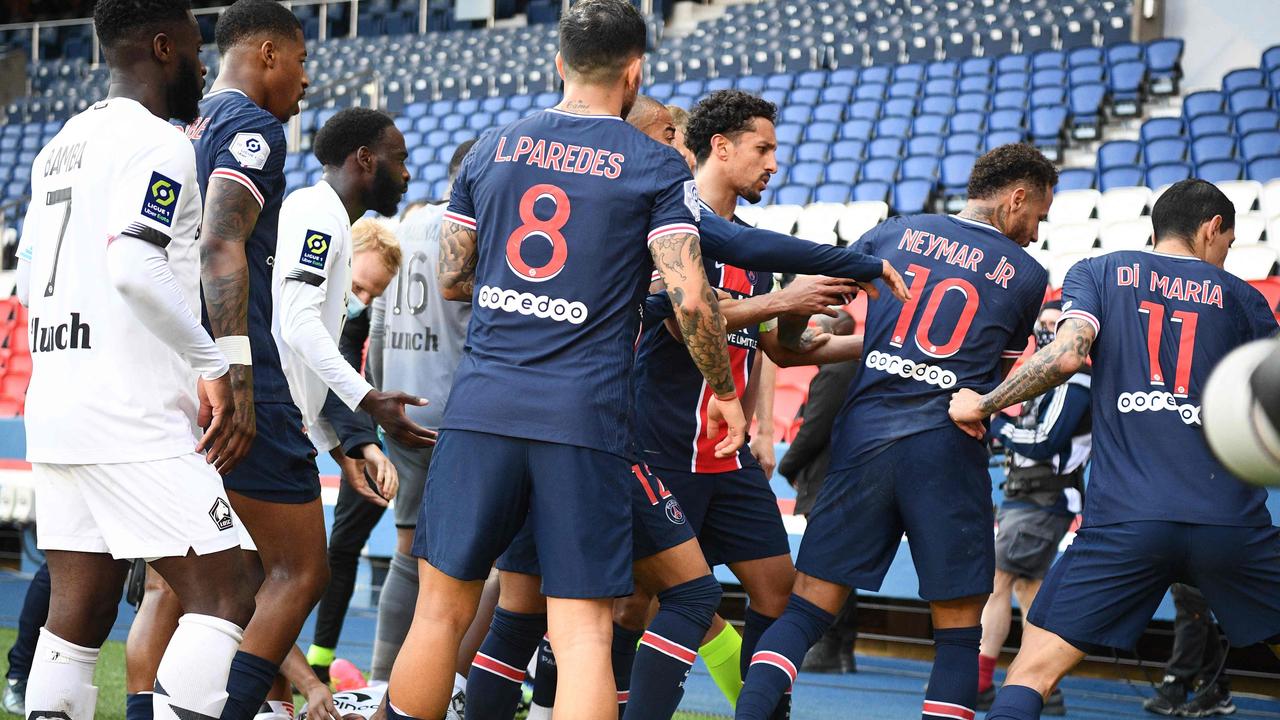 Paris Saint-Germain's Brazilian forward Neymar (2R) reacts as Lille's Portuguese defender Tiago Djalo (L) lays on the ground during the French L1 football match between Paris-Saint Germain (PSG) and Lille (LOSC) at the Parc des Princes Stadium in Paris, on April 3, 2021. (Photo by FRANCK FIFE / AFP)